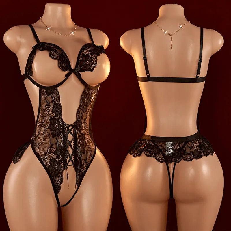 Front and back views of a black floral lace open-cup bodysuit with lace-up detailing on display mannequins
